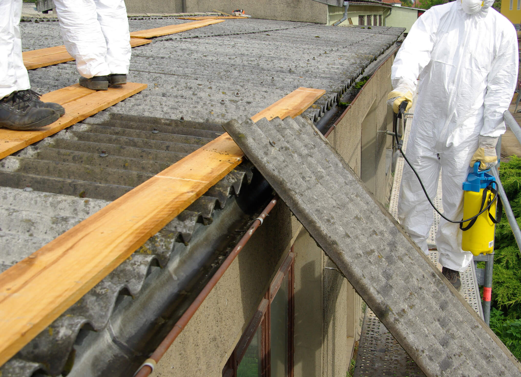 Licensed asbestos removal and disposal team working safely in London