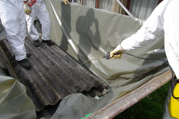 Licensed asbestos disposal truck collecting waste in London