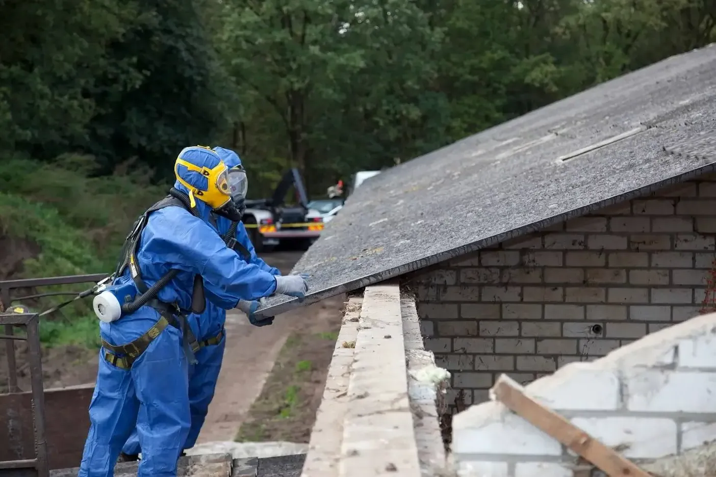 Asbestos insulation and lagging being packaged for disposal